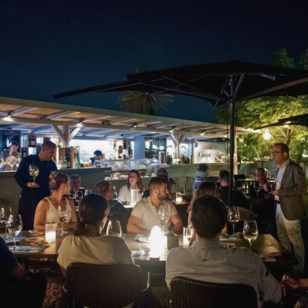 Guests attending a Greek wine tasting and hospitality event as part of the WineBars.gr network experience.