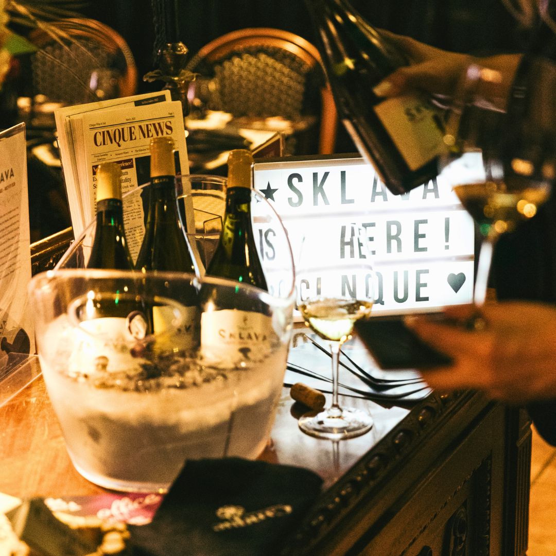 Greek wine tasting event featuring winery presentations, premium wines and guest engagement at Cinque Wine & Deli.