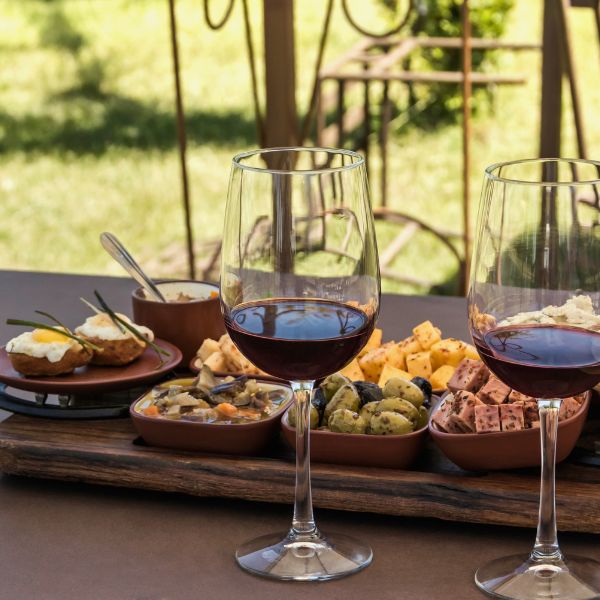 Greek wine paired with local delicacies during a food and wine tasting experience.