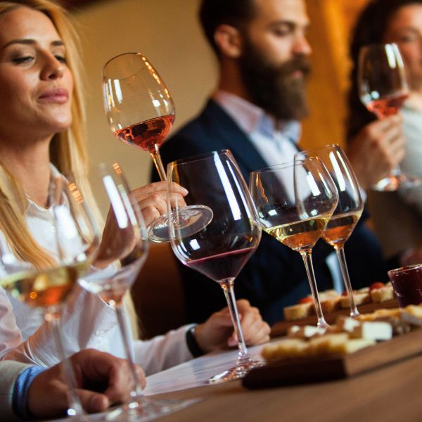 Guests evaluating wines during a guided tasting experience focused on aroma, flavour and wine appreciation.